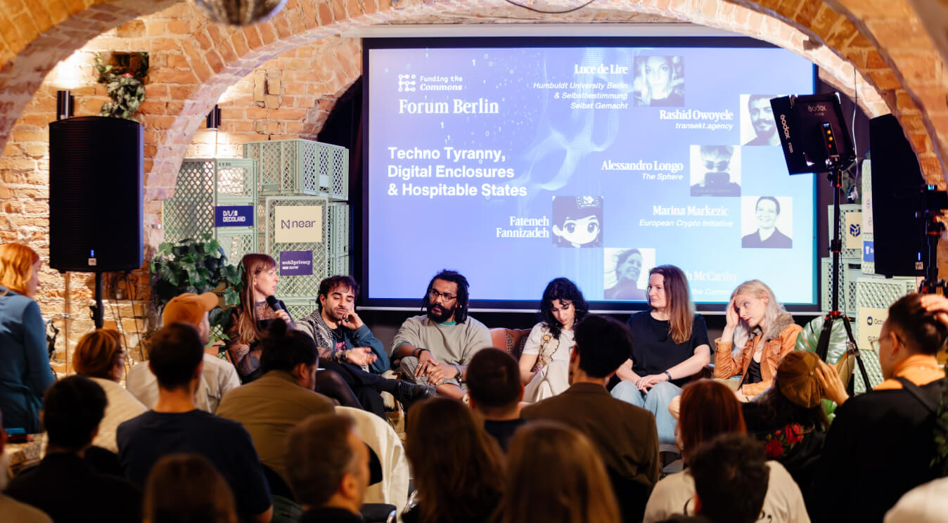 A panel on stage at Forum Berlin