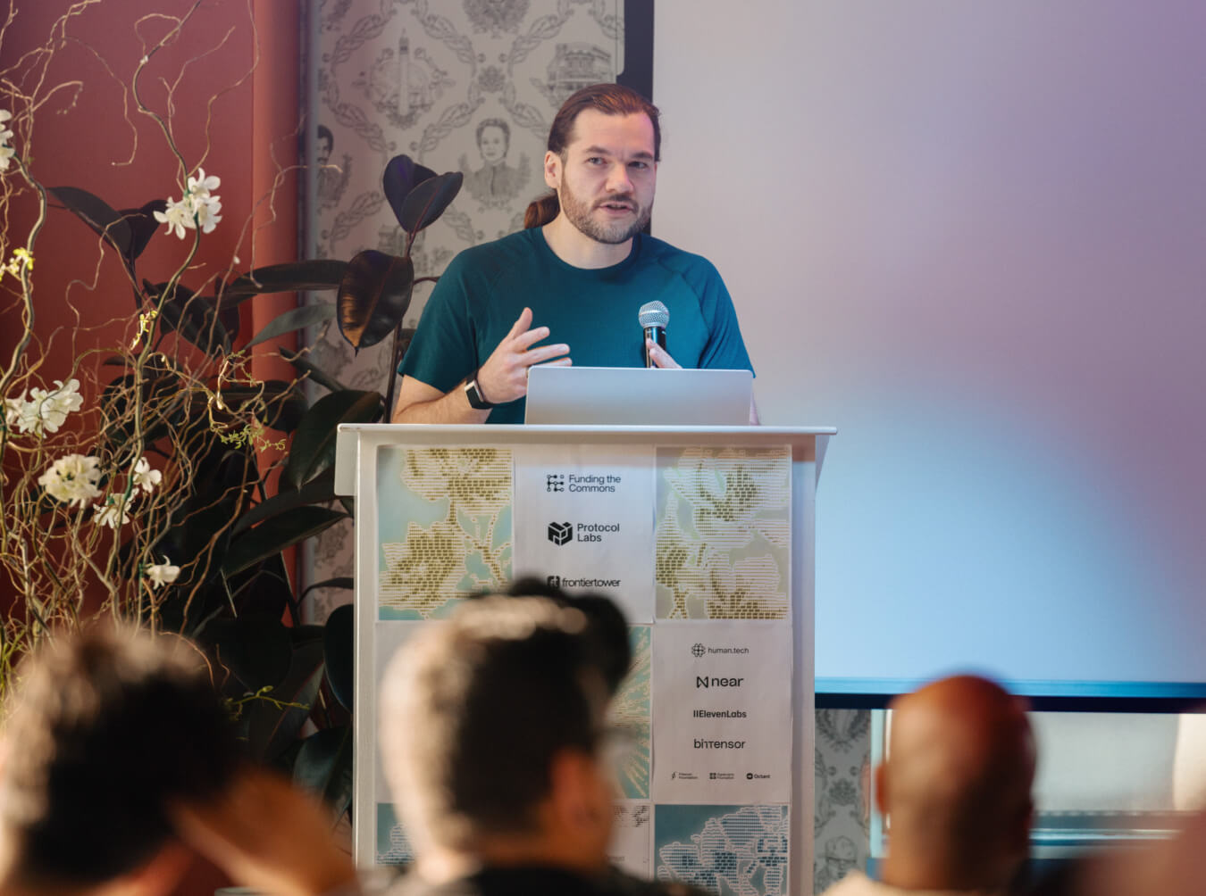 A speaker presenting to the room